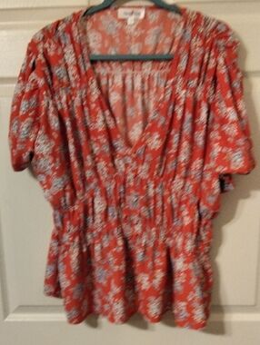 Perfectly Priscilla Floral V-Neck Peplum Top - Coral